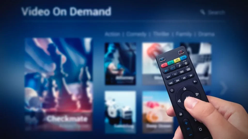 Video on demand: a remote control in a person's hand