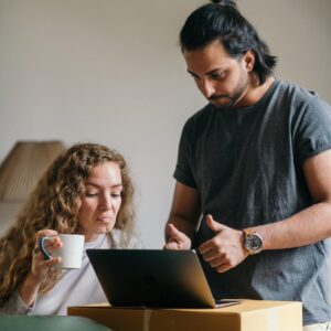 young-couple-buying-things-for-new-house-online-using-laptop